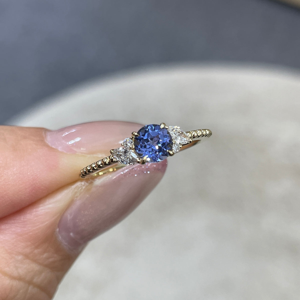 9k Lab grown sapphire cornflower round 0.6ct with marquise side stone milgrain ring