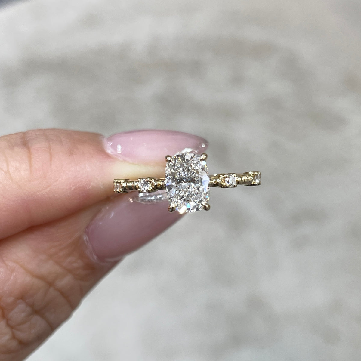 IGI Lab Diamond long cushion 1ct four-prong side stone with milgrain band ring