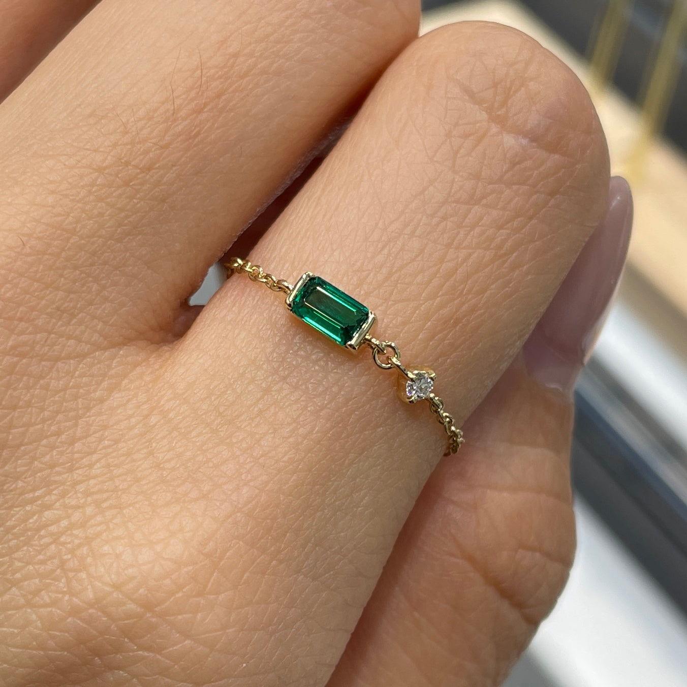 Lab Grown Emerald half bezel with little diamond chain ring