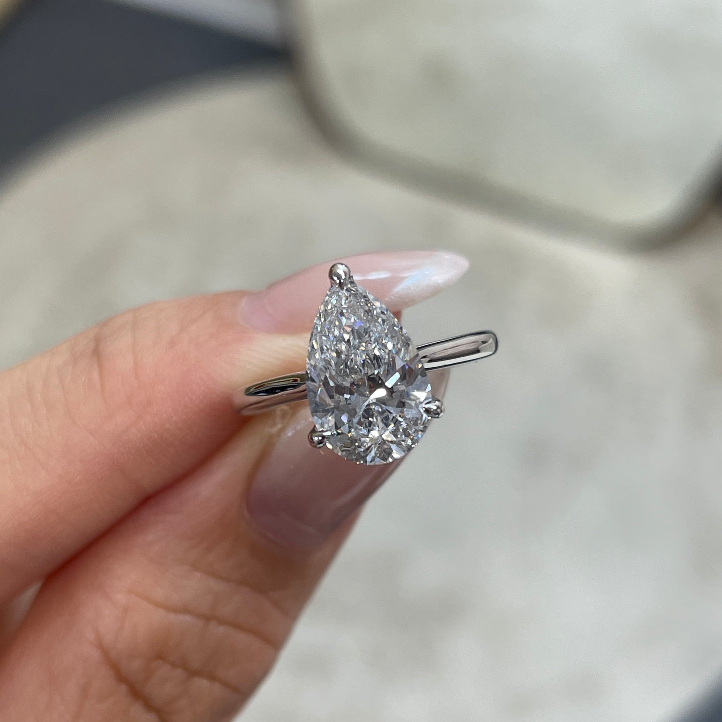 IGI Lab diamond pear shape 2.27ct three-prong underhalo ring