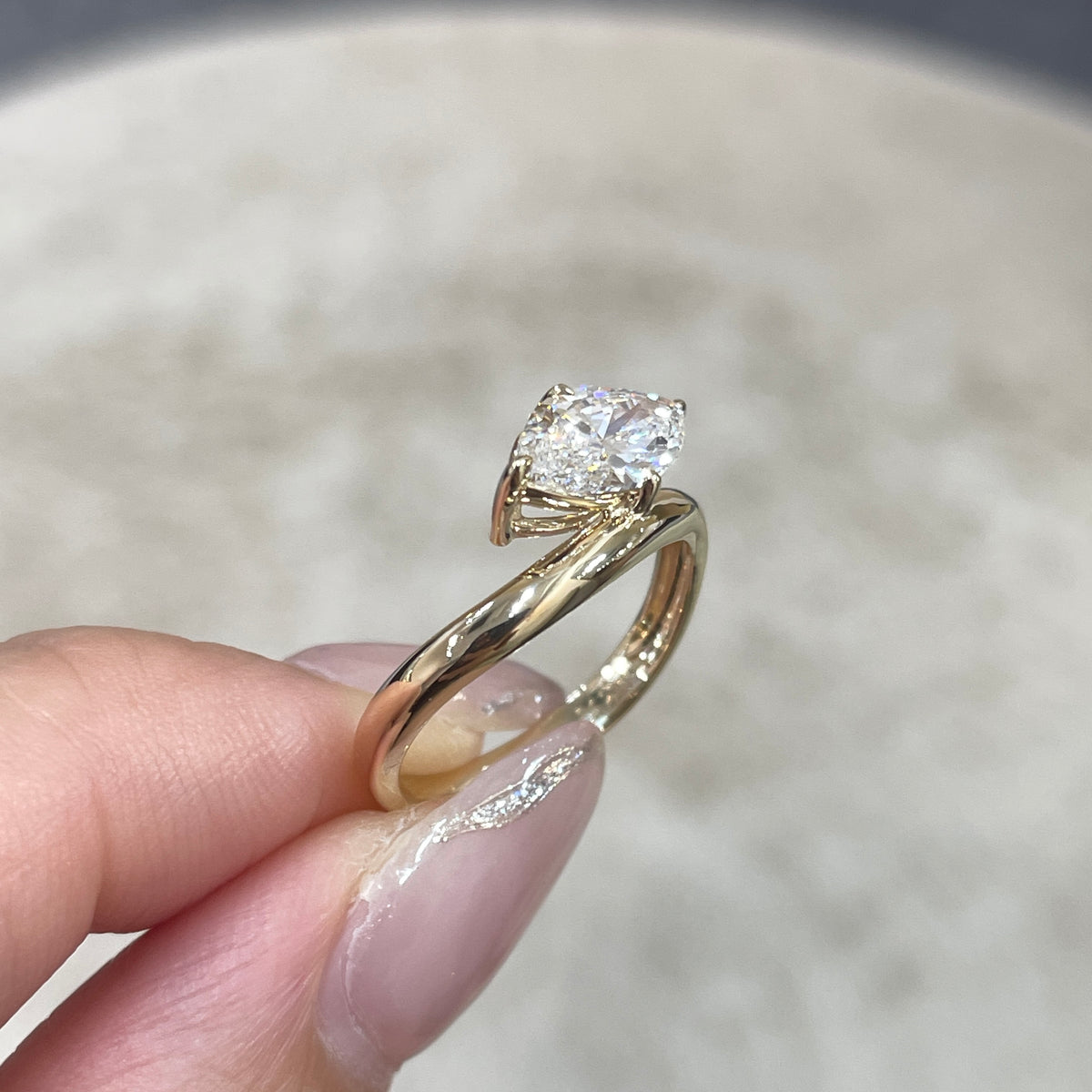 9k IGI Lab diamond marquise shape 1.2ct compass four-prong wavy ring