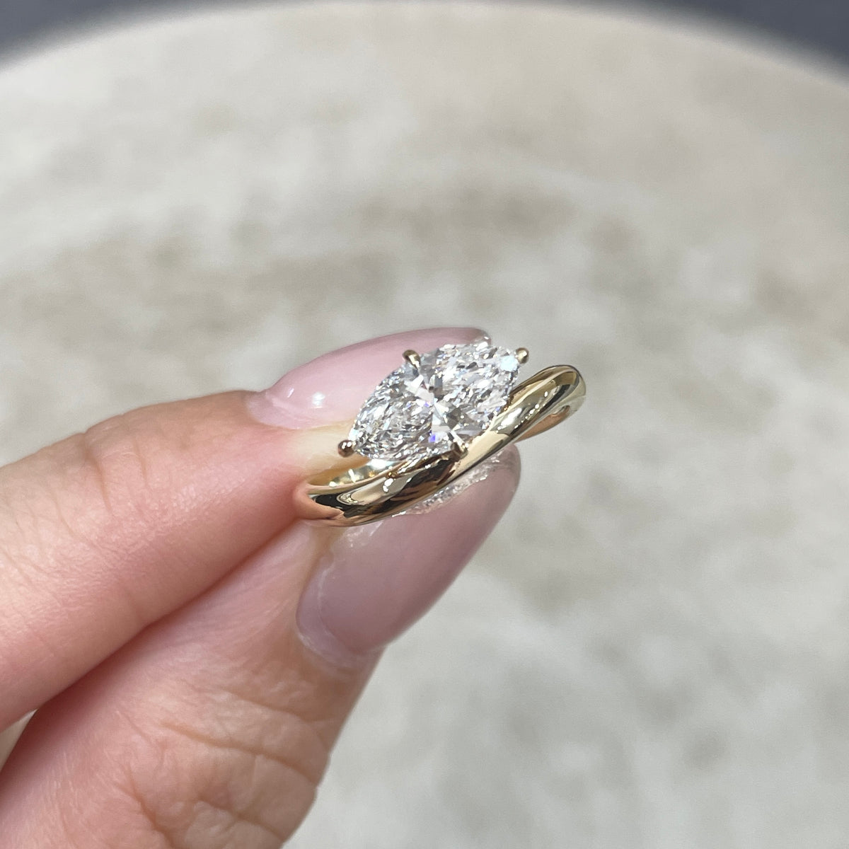 9k IGI Lab diamond marquise shape 1.2ct compass four-prong wavy ring