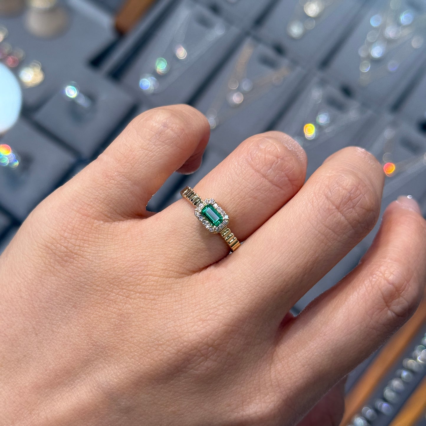 Lab Emerald emerald cut 0.25ct halo set with vertical line band ring