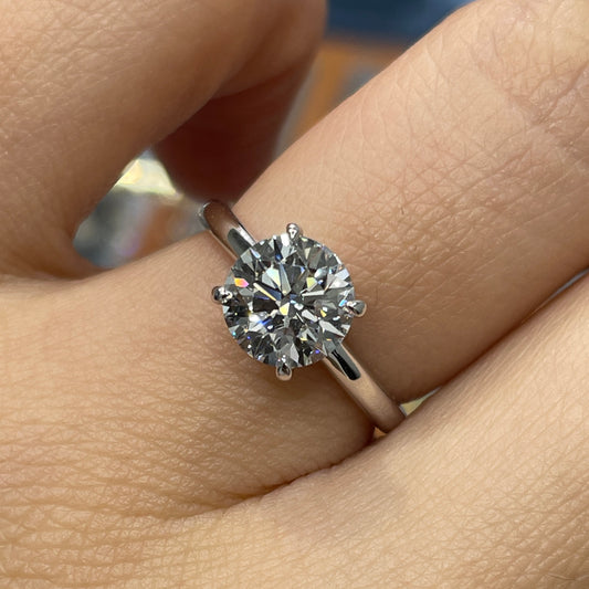 IGI lab diamond round 1.5ct four-prong low setting solitaire ring