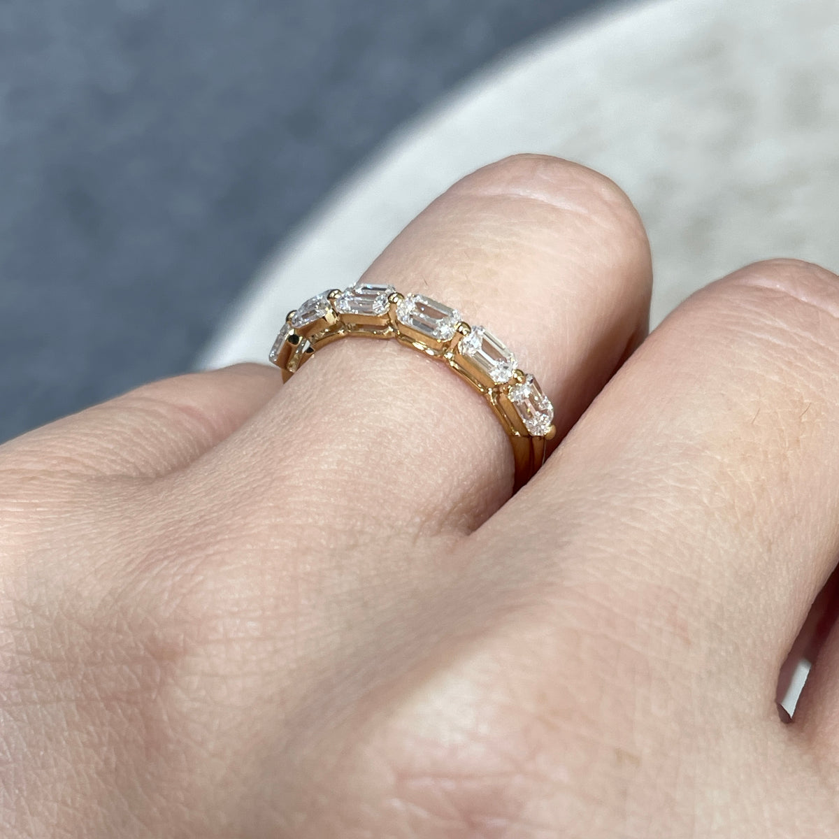 9k Lab diamond emerald cut 1.2ct single-prong horizontal half eternity ring