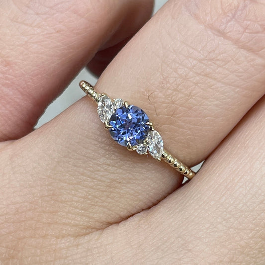 9k Lab grown sapphire cornflower round 0.6ct with marquise side stone milgrain ring