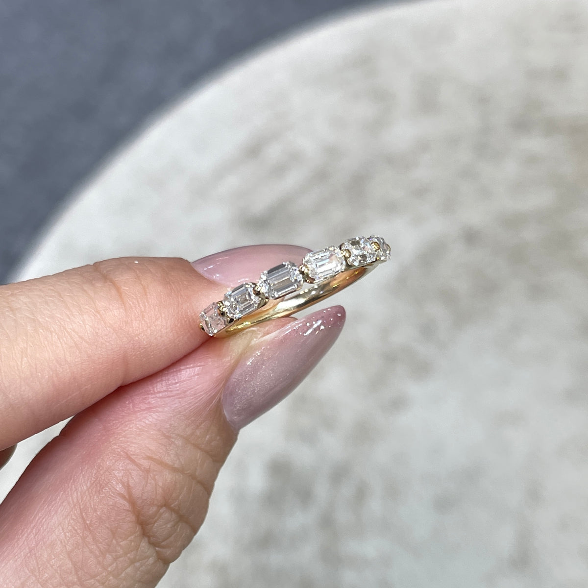 9k Lab diamond emerald cut 1.2ct single-prong horizontal half eternity ring
