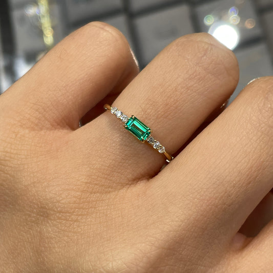 Lab Emerald baguette cut 0.35ct four-prong side stone ring