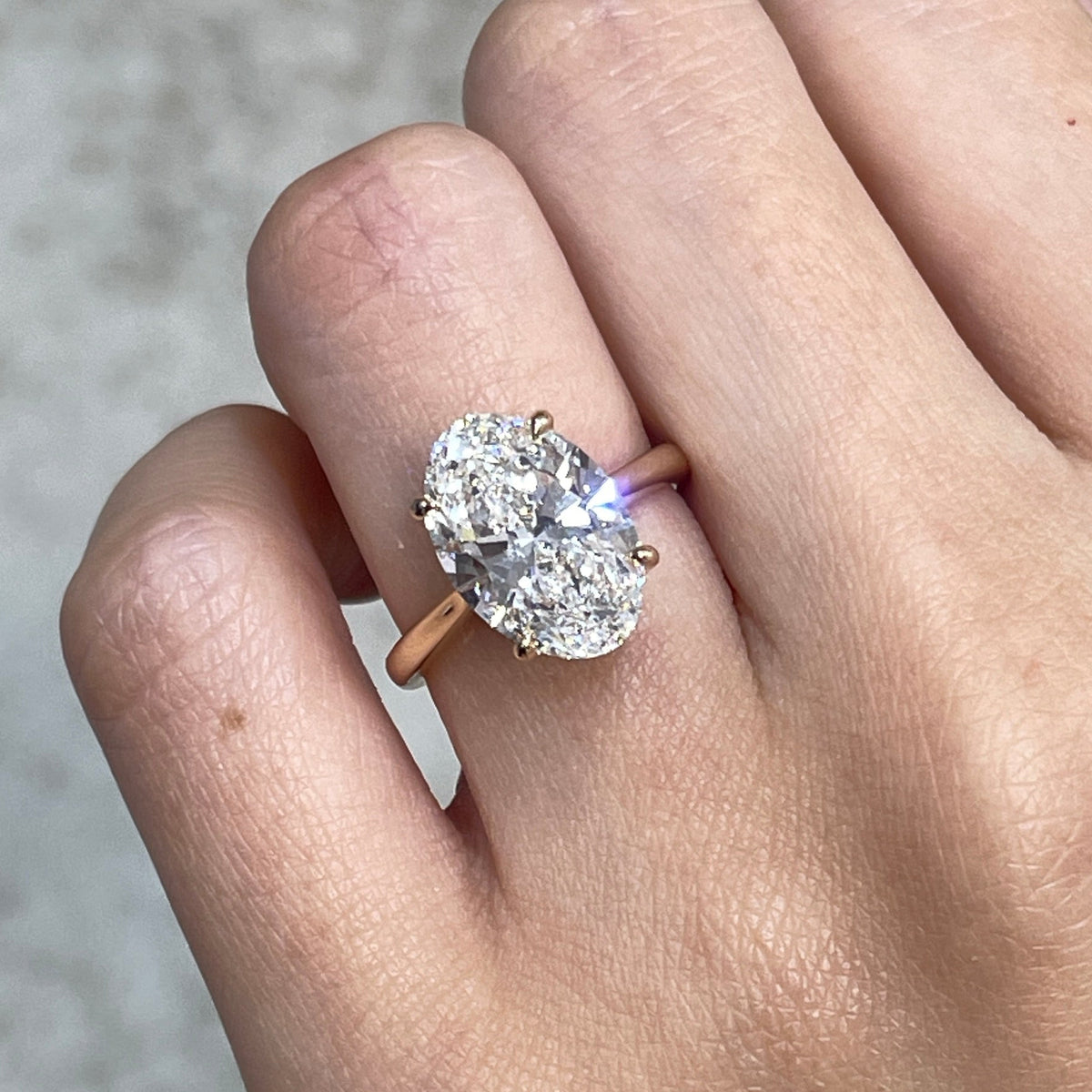 IGI Lab diamond Oval 3.5ct four-prong underhalo ring