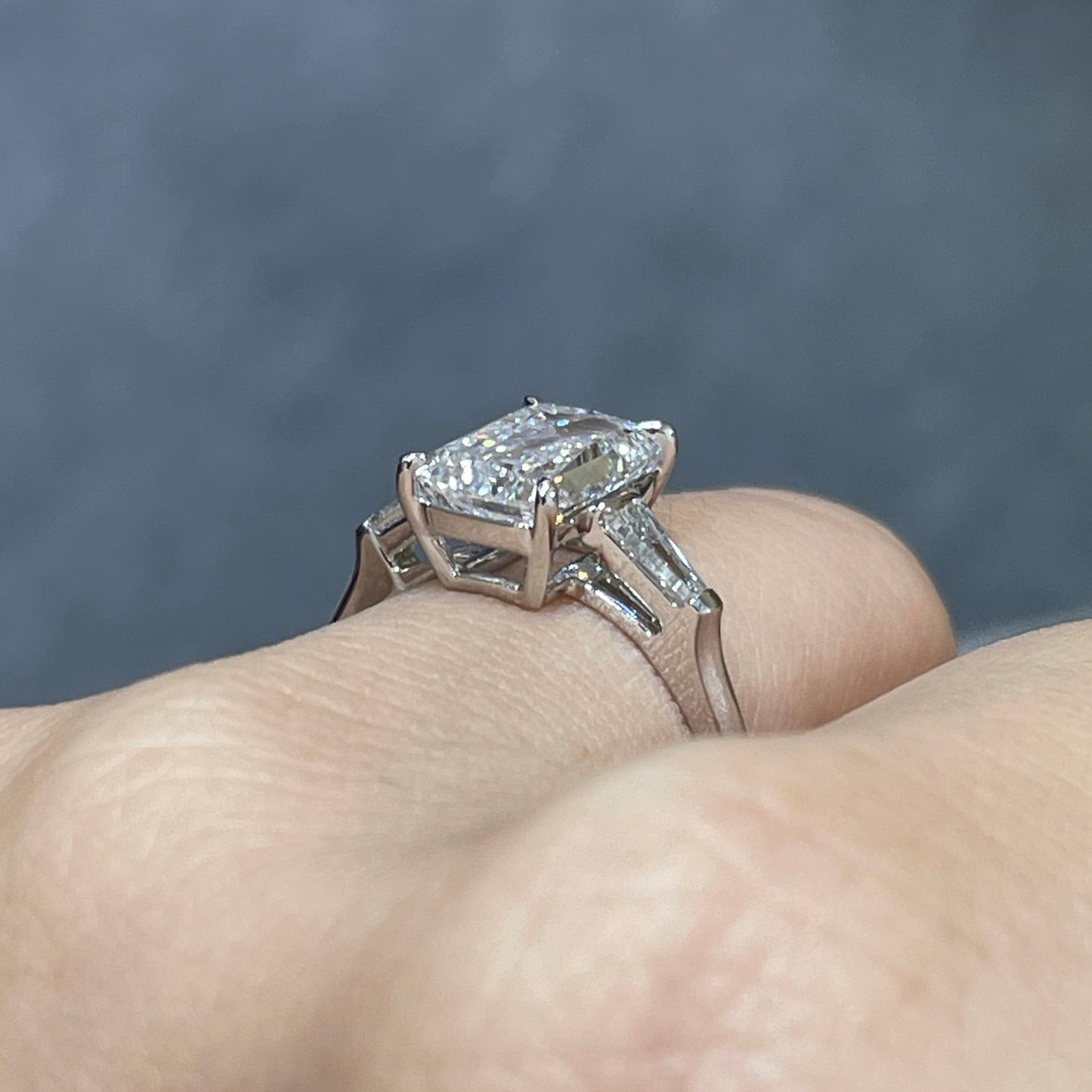 IGI Lab diamond Emerald criss cut 2.5ct with tapered baguette cut 0.3ct three stone ring