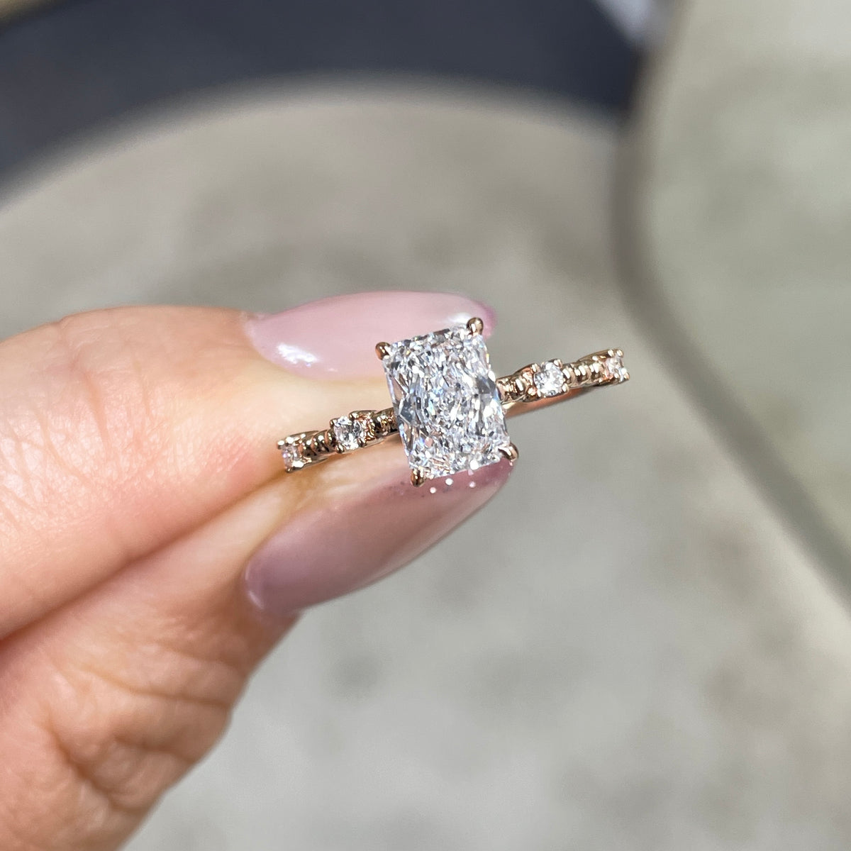 Lab Diamond radiant cut 1ct four-prong side stone with milgrain band ring