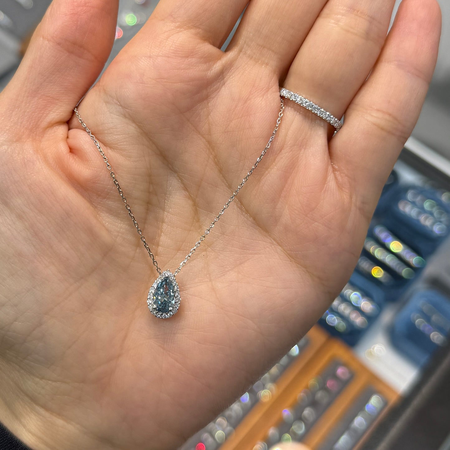 IGI Lab blue diamond Pear shape 1ct two way halo pave ring