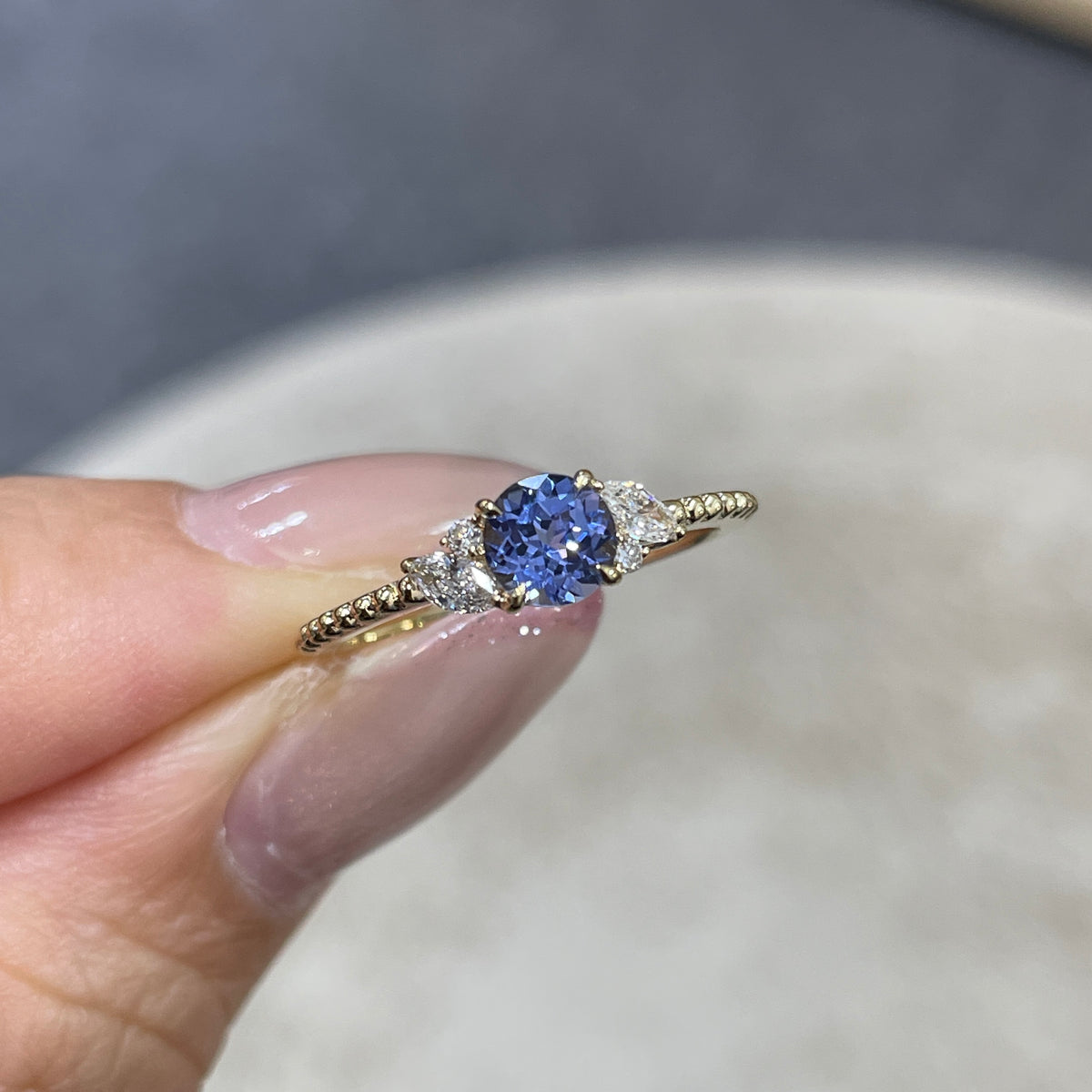 9k Lab grown sapphire cornflower round 0.6ct with marquise side stone milgrain ring
