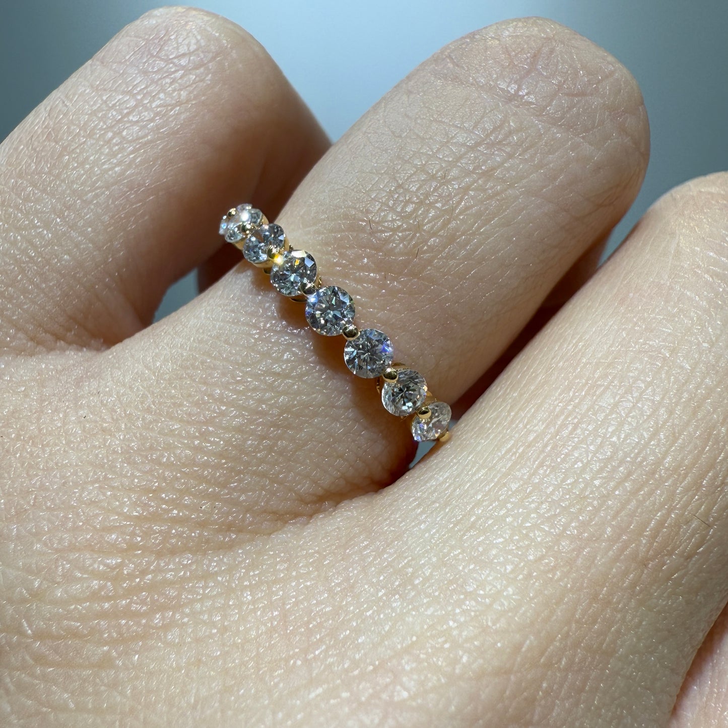 Lab diamond round 0.6ct single prong half eternity ring