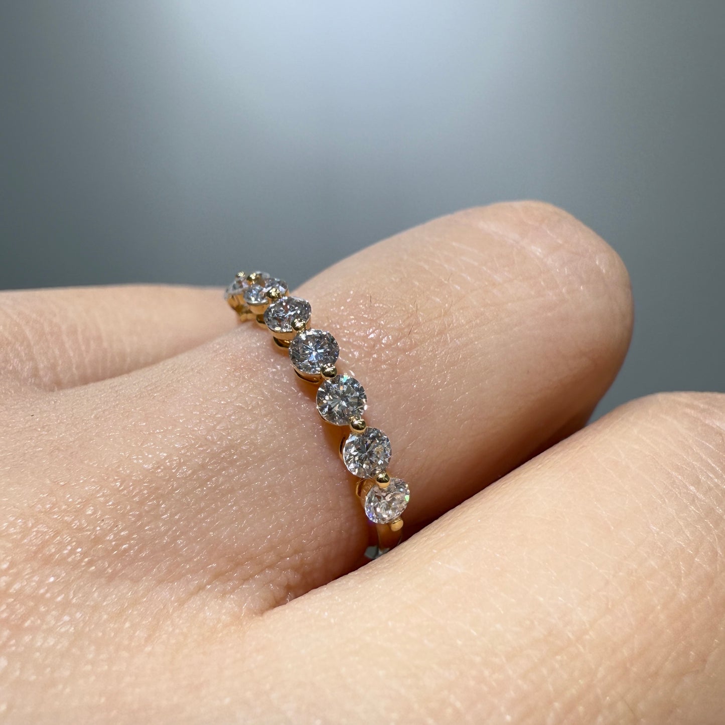 Lab diamond round 0.6ct single prong half eternity ring