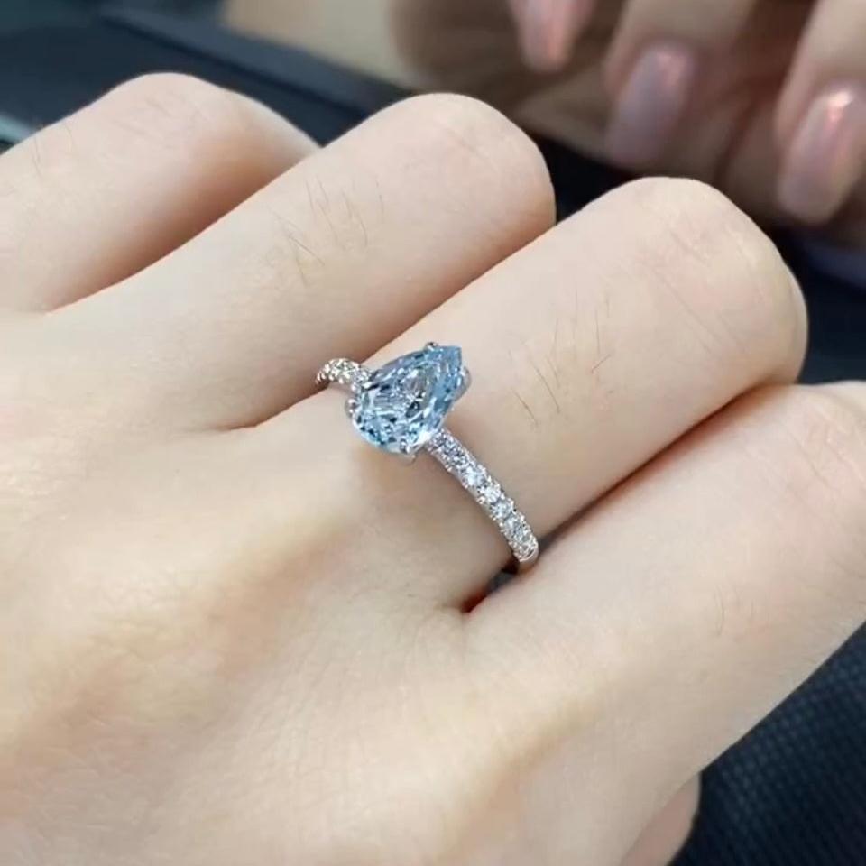 Lab sapphire Pear shape 1.5ct pave band ring