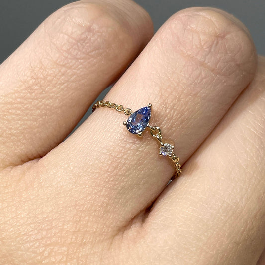 Lab sapphire cornflower pear shape 0.2ct with little diamond chain ring